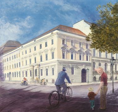 Grundschule Max Dortu - ein weißes, barockes Eckhaus, vor dem ein Radfahrer auf der Straße entlang fährt
